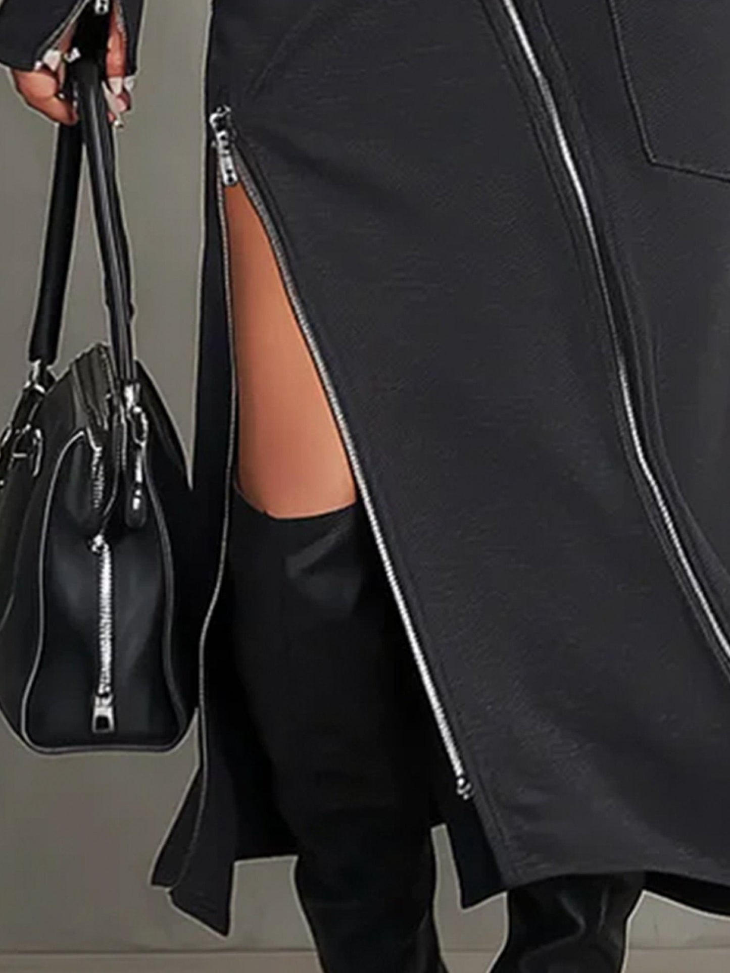 Ensemble à col montant avec poches zippées irrégulières